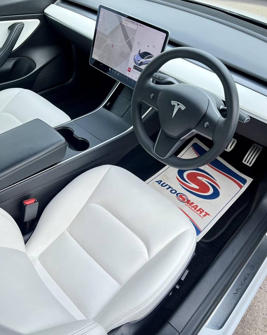 Tesla Model 3 white interior after detailing