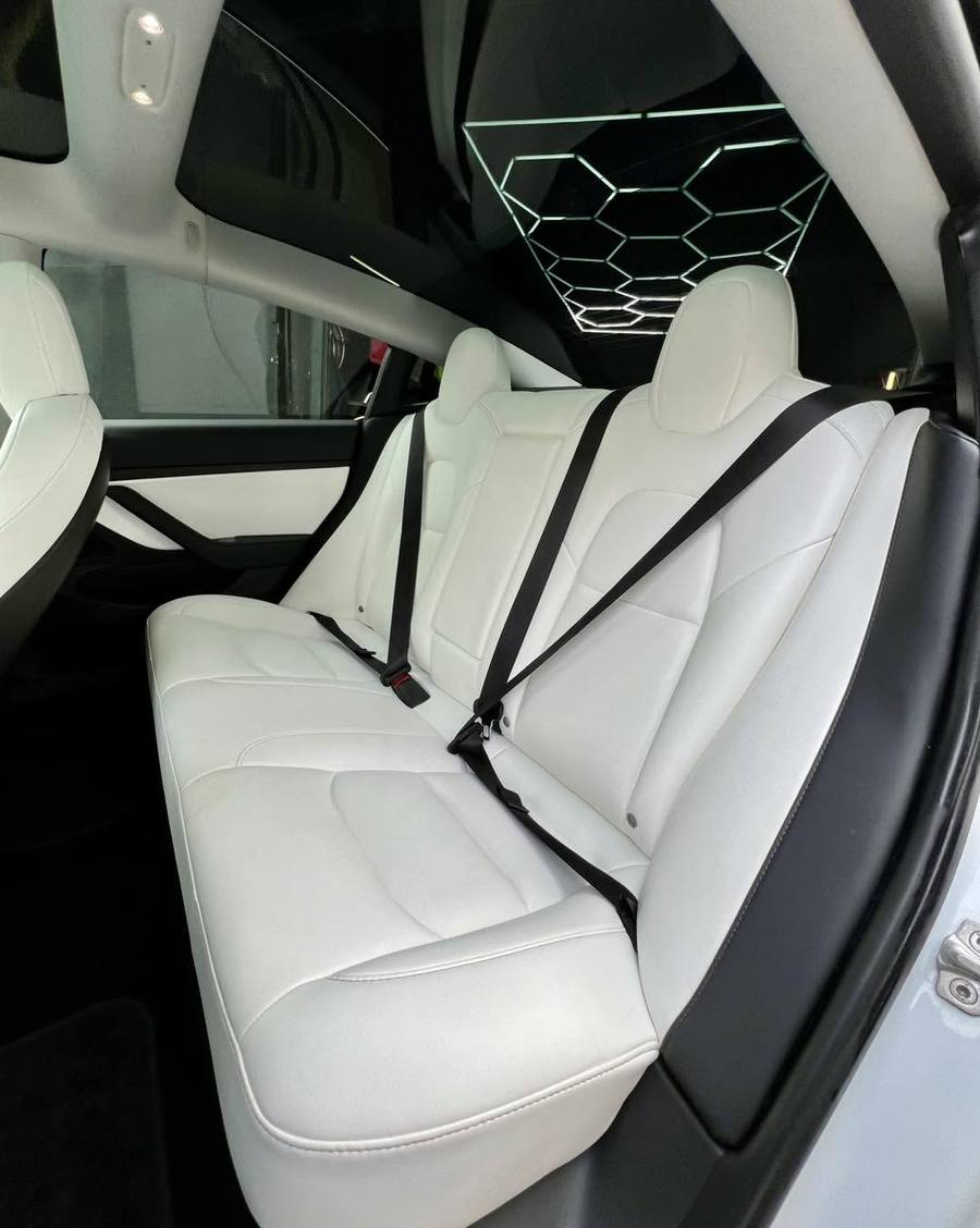 Tesla Model 3 rear seats in white after detailing