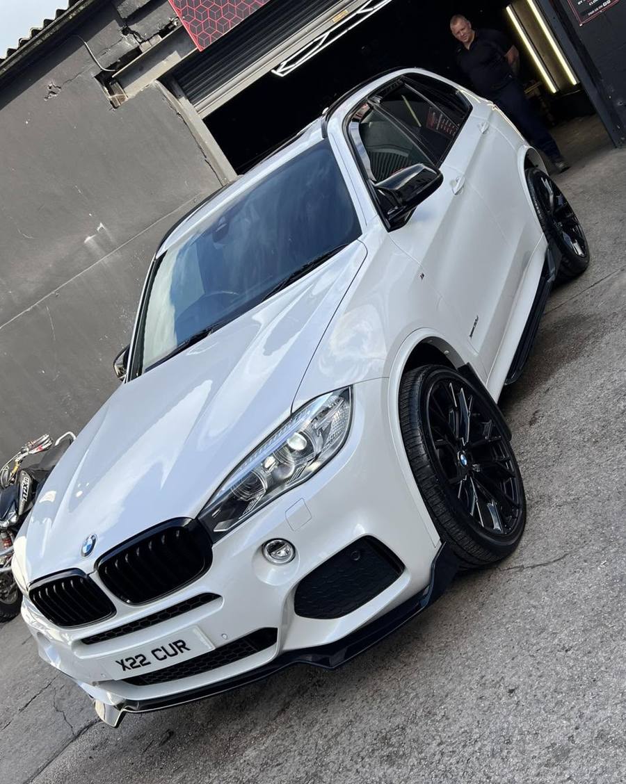 White BMW X5 M Sport outside the unit